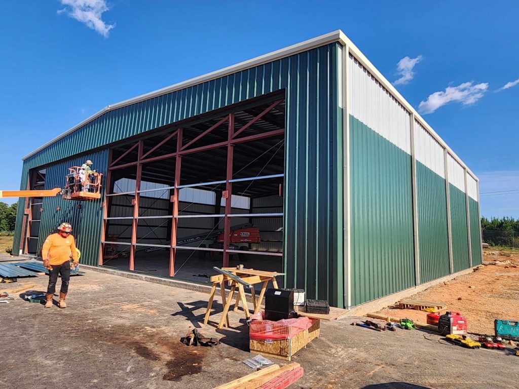 Outside of a steel airport hangar